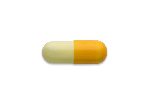 yellow pills capsule isolated on white background