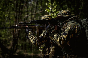 Military men with submachine gun