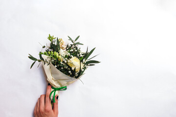 Small bouquet of freesia, tulip and hyacinth flowers on white background