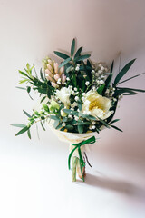 Small bouquet of freesia, tulip and hyacinth flowers on white background