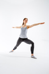Young woman exercising in yoga