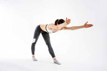 Sporty girl engaged in gymnastics