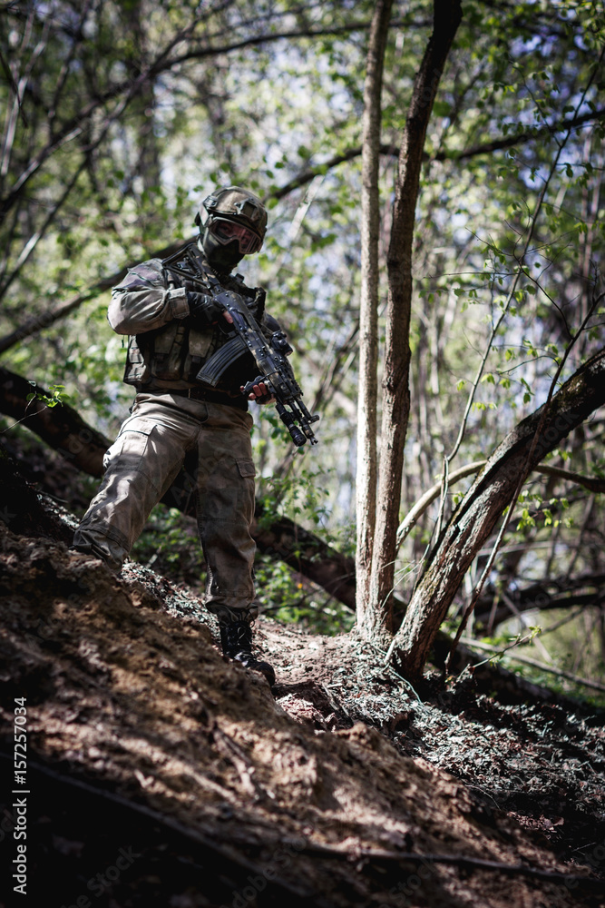 Wall mural Soldier in army with gun