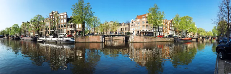 Fototapeten Häuser an Gracht in Amsterdam als Panorama © Dan Race