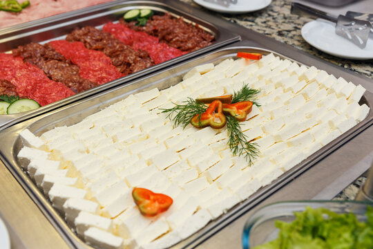 Tray of sliced different kind of cheese