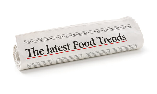Rolled newspaper with the headline The latest Food Trends