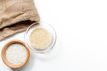 paella ingredients with rice and towel on white table background top view mock up