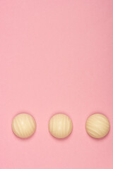 Top view of three white chocolate candies isolated on pink background