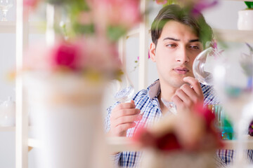 Young handsome man shopping in shop