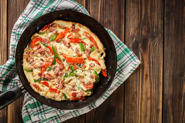 Fresh omelette with bacon and bell pepper