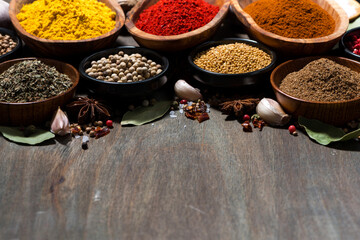 assortment of spices on a wooden background