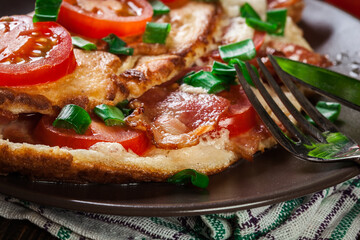 Omelette with bacon and tomatoes