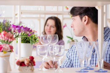 Young family shopping in shop