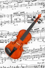 Fototapeta premium Toy violin and music sheet