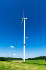 Fototapeta na wymiar windmill and blue sky at a sunny day