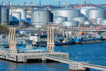 No drill light filtering roller blinds Port Oil product tank depot in Stockholm industrial sea port. Sweden.