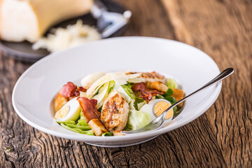 Salad. Salad Ceasar. Ceasar salad with quail egg lettuce bacon crutons and grill chickens breast.