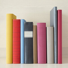 stack of new colorful books in the bookself - 157264270