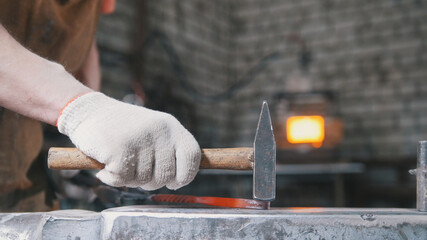 Work in forge - Hammer on the anvil, metal work, close up
