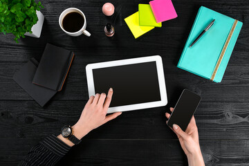 Hand use tablet on desk table top view