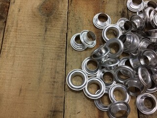 Silver Eyelet Ring on Wood Table