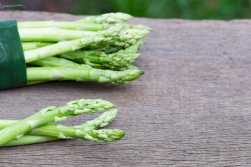 Asparagus. Raw asparagus. Fresh Asparagus.Green Asparagus on wooden background