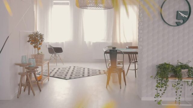 Table standing next to a carpet in bright stylish room

