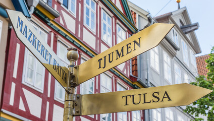 Sign giving directions to Tulsa, Tjumen and Mazkeret Batya in Celle