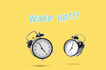 black alarm clock isolated on yellow background. concept wake up.