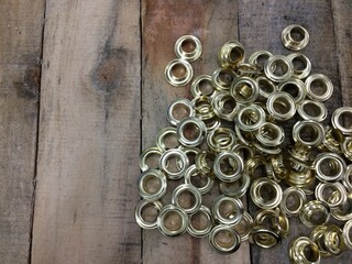 Gold Eyelet Ring on Wood Table