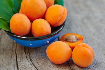 Ripe apricots fruit on rustic wooden table
