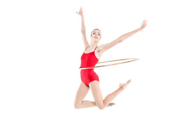 Fototapeta na wymiar Sportive rhythmic gymnast training with hoop on waist isolated on white