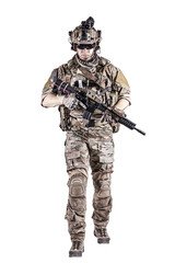 US Army rangers in combat uniforms with his shirt sleeves rolled up, in helmet, eyewear and night vision goggles moving walking towards camera. Studio shot, white background