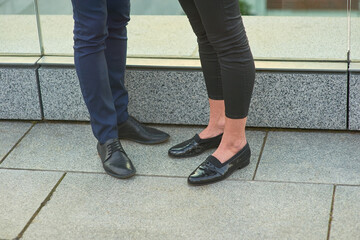 Male and female legs, fashion. Pants and shoes. How to dress business casual.