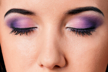 Close-up portrait of beautiful young woman or young girl with closed eyes - make-up