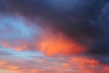 Naklejka na ściany i meble Beautiful sunset with pink and orange clouds. Evening sky background.