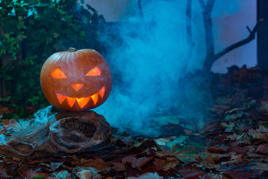 Glowing and Smoking Jack-o-Lantern with Copy Space