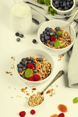 Healthy breakfast -  Homemade granola, honey, milk and berries