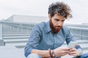 Young man using his smartphone