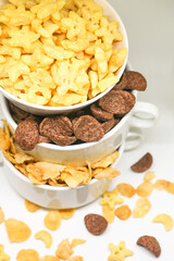 Cornflake cereals in a white bowl. Easy breakfast for kids. Quick breakfast.
