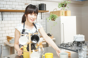 Young woman making some coffee