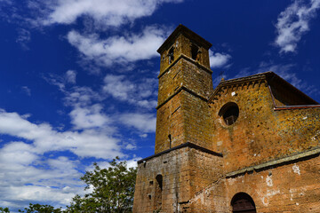 Fototapeta na wymiar San Giovenale medieval church in Orvieto with clouds