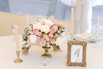 Guest numbered table with with adorable bouquet, closeup