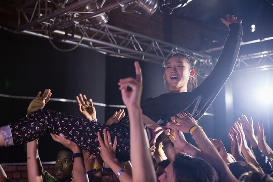 Crowd surfing at a concert