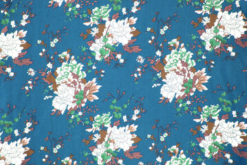 Fototapeta na wymiar fabric pattern with classical image of the colorful flowers on blue background.
