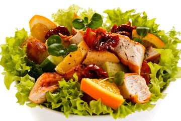 Salad with grilled chicken on white background
