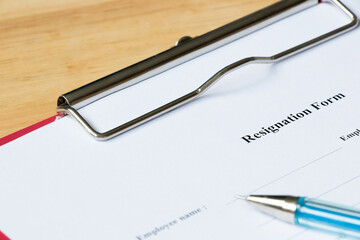 Resignation form on wood desk background