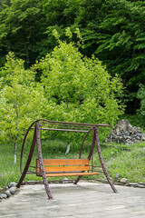 Swing chair, bench in the forest park