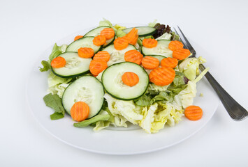 Sliced Carrots and Cucumbers on Salad
