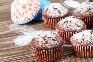 Сhocolate muffins with powdered sugar